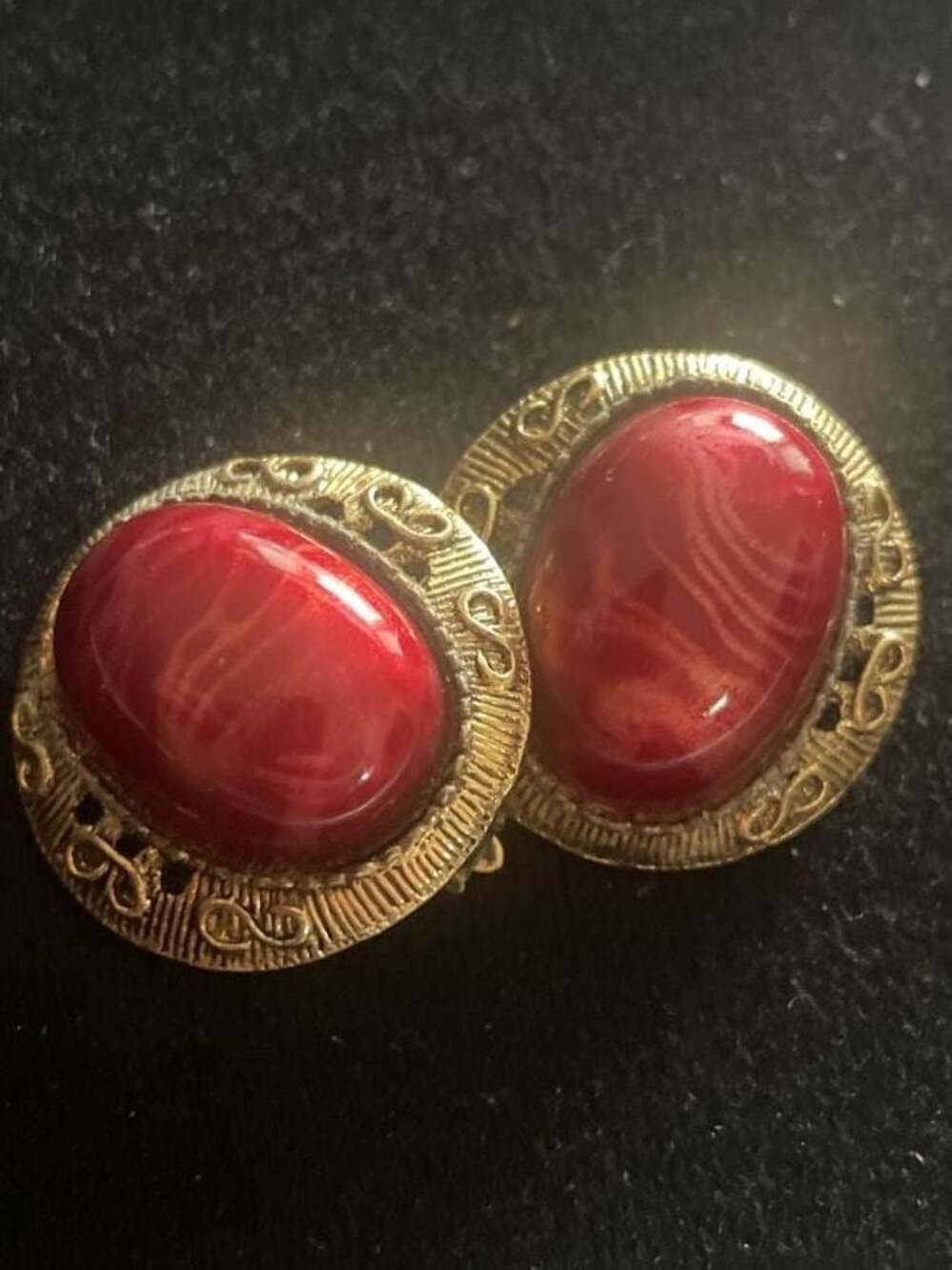 Vintage 1980s Gold Tone Filigree Clip-On Earrings with Red Swirled Resin Cabocho